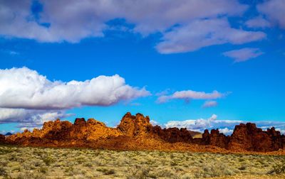 Scenic view of mountain against blue sky