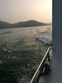 Scenic view of sea against clear sky during sunset