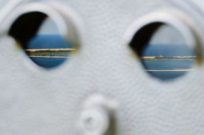 Detail shot of coin operated binoculars facing sea