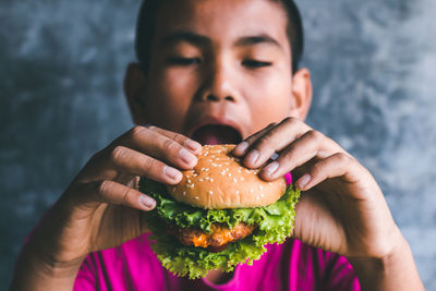Close-up of boy eating food