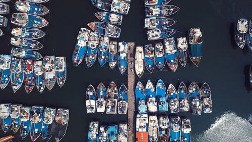 Top angle view of boats parked in a marina 