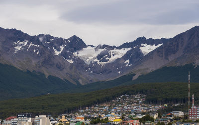 High angle view of townscape and mountains against sky