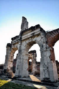 Low angle view of old ruins against sky