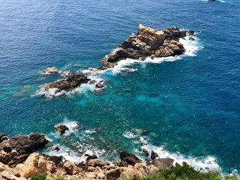 High angle view of rocks on shore