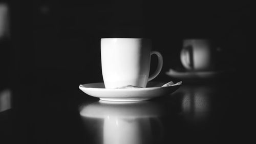 Close-up of coffee cup on table