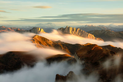 Scenic view of mountains against sky during sunset