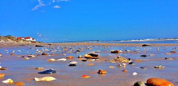 Scenic view of sea against clear blue sky