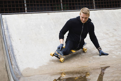 Handicapped man on skateboard