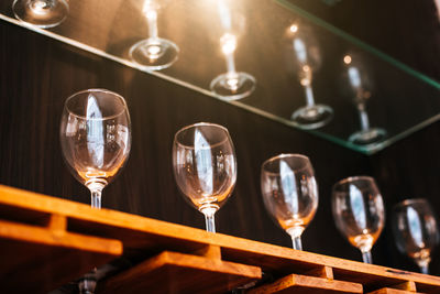 Close-up of wine glasses on table