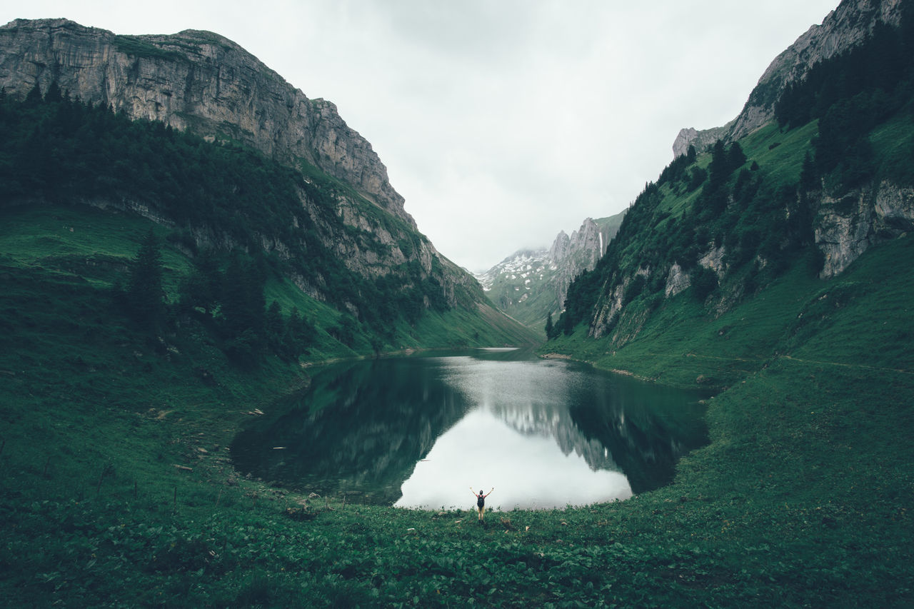 Standing at lake