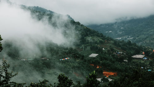 High angle view of trees and mountains against sky