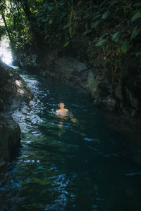 River flowing through rocks in forest