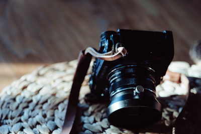 High angle view of camera on wooden table