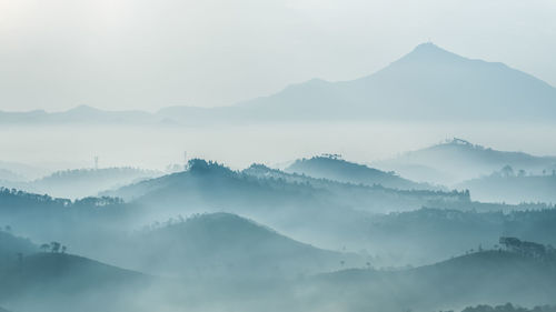 Scenic view of mountains in foggy weather