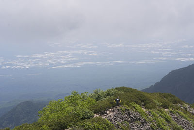 Scenic view of mountains and sea against sky