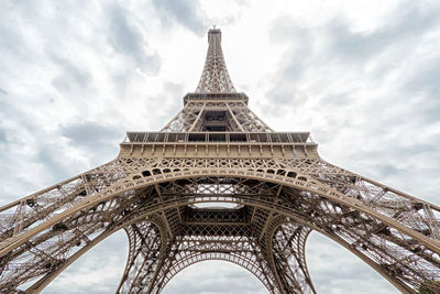 Low angle view of tower against cloudy sky