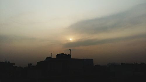 Silhouette of buildings at sunset