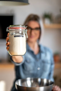 Portrait of woman holding drink