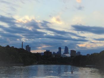 Scenic view of river against sky during sunset