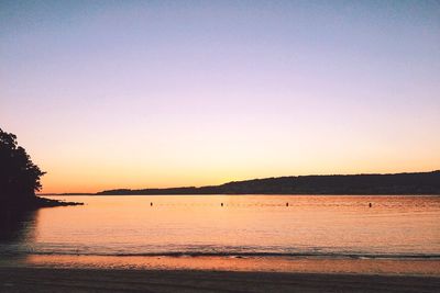 Scenic view of calm sea at sunset