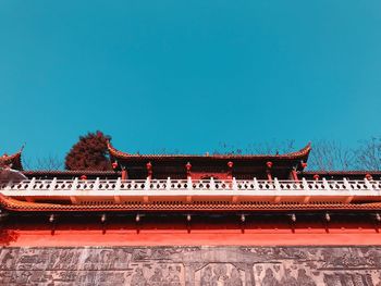 Low angle view of building against blue sky