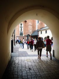 People walking in front of building
