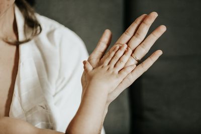 Midsection of woman gesturing