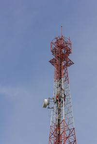 Low angle view of communications tower against sky