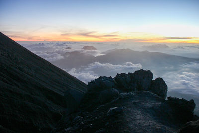 Scenic view of mountains against sky during sunset