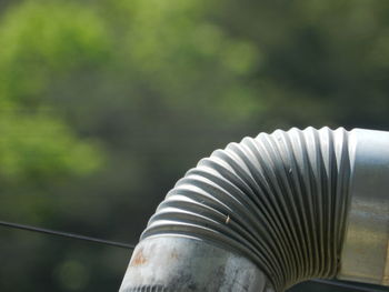 Close-up of metal railing against blurred background