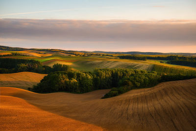 Scenic view of landscape against sky during sunset