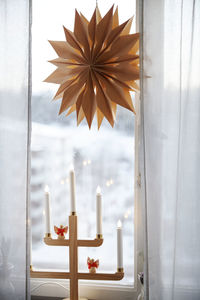 Christmas candles and paper decoration