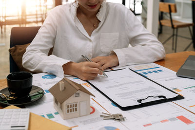 Midsection of business colleagues working at office