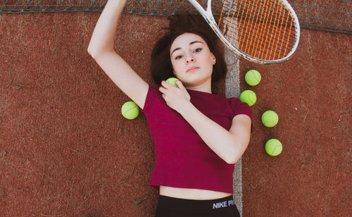 High angle portrait of young woman with ball