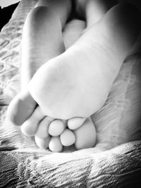 Close-up of baby sleeping on bed