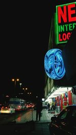 Illuminated road sign at night