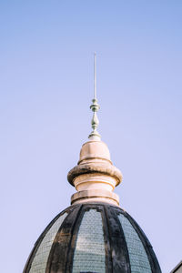 Low angle view of building against clear blue sky