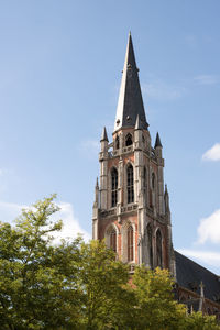 Low angle view of building against blue sky