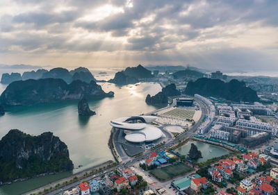 High angle view of city against cloudy sky