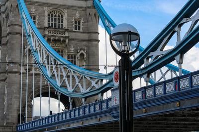 Low angle view of bridge against blue sky