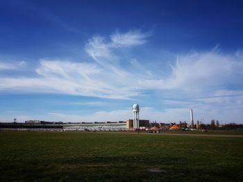 View of buildings against cloudy sky