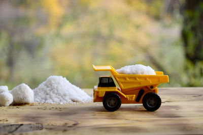 Toy truck with salt on table