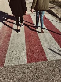 Low section of people walking on road