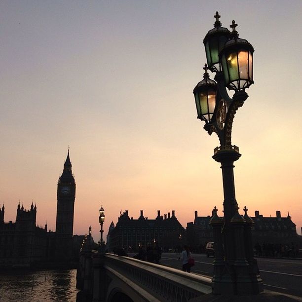 architecture, built structure, building exterior, sunset, city, clear sky, travel destinations, famous place, international landmark, tower, river, travel, connection, water, capital cities, tourism, bridge - man made structure, copy space, street light, sky