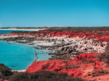 Scenic view of sea against clear blue sky