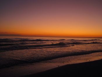 Scenic view of sea against clear sky during sunset
