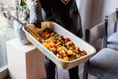 High angle view of woman holding food