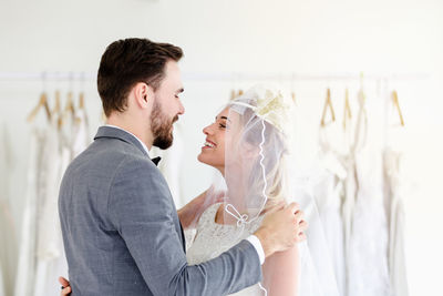 Side view of a smiling young couple