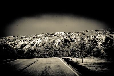 Road amidst landscape against sky