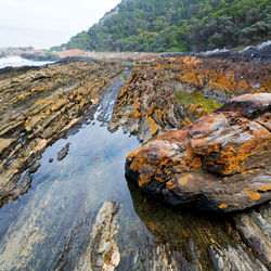 Aerial view of rocks on land against sky